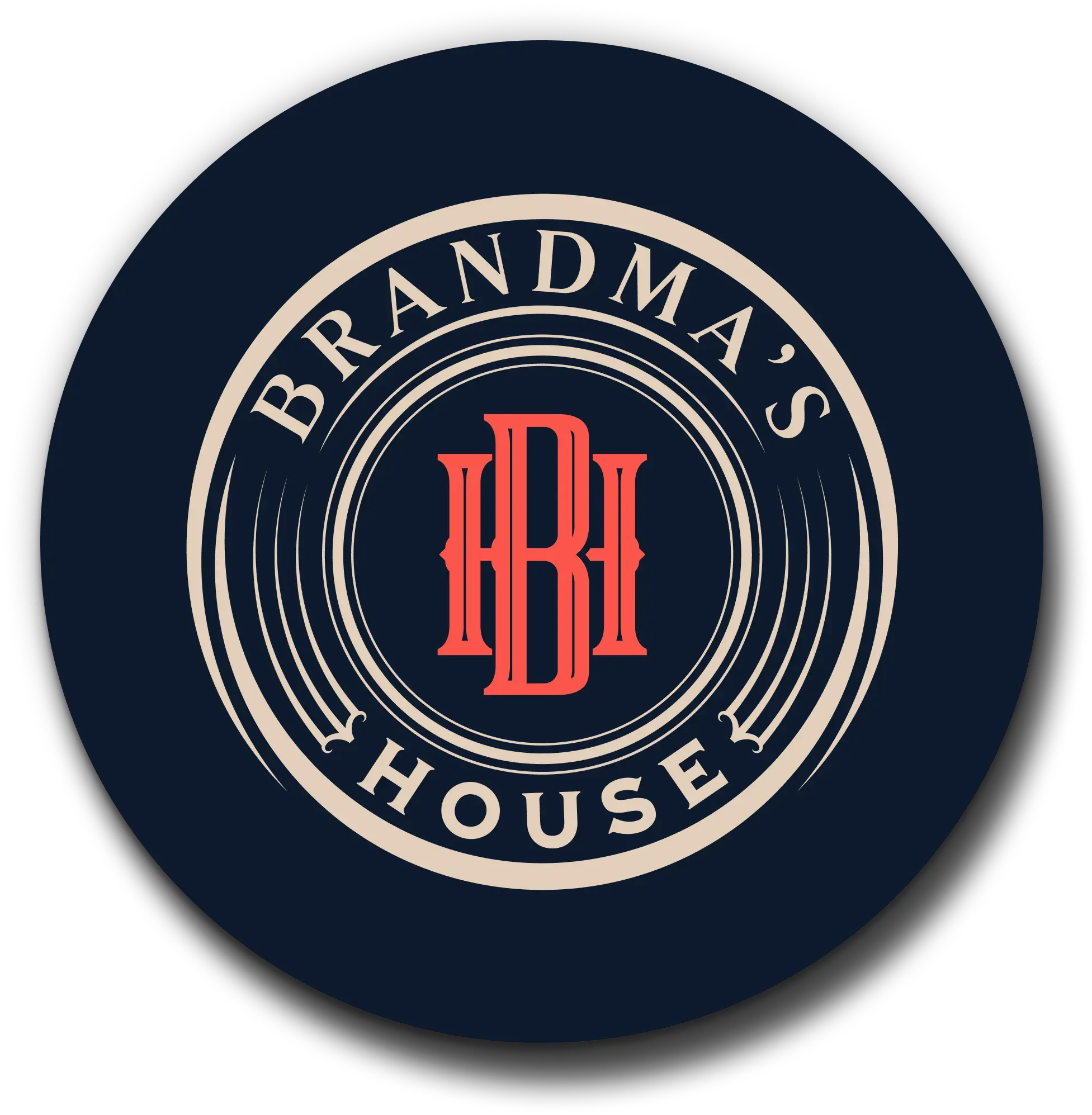 Ghetto Country Brandmother: circular Brandma's House badge mark in navy, cream, and coral