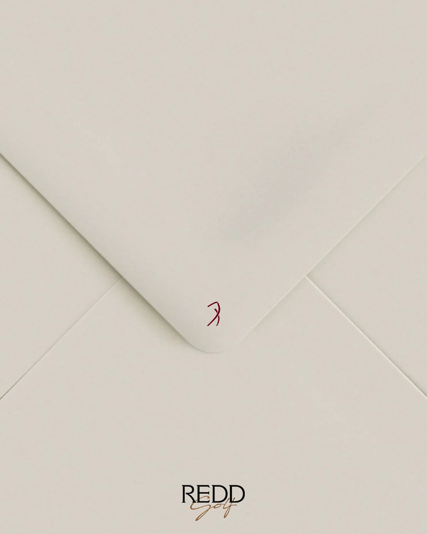 White envelope with the Redd Golf wordmark