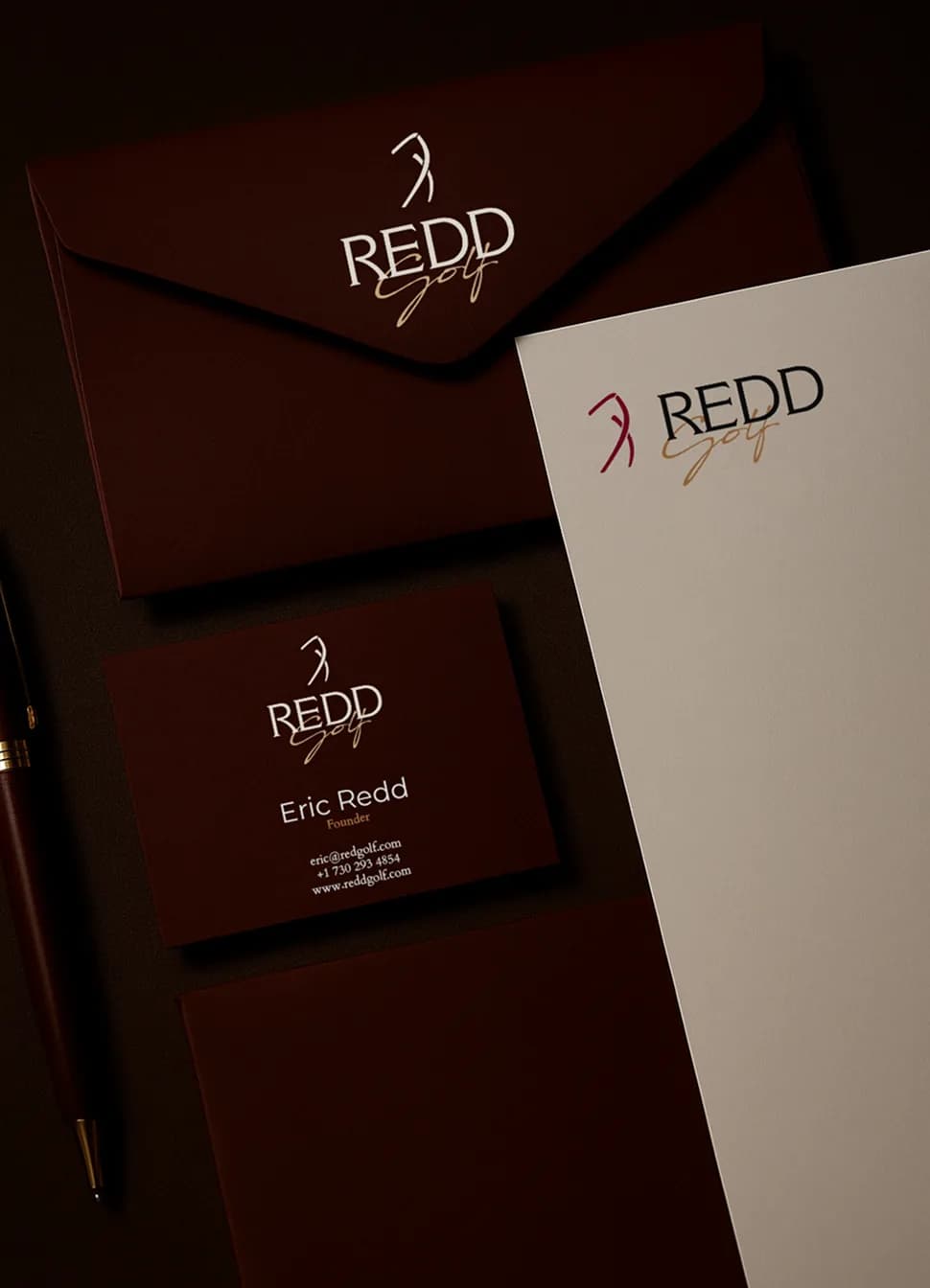 Redd Golf envelopes, letterhead, and Eric Redd business card in maroon and cream